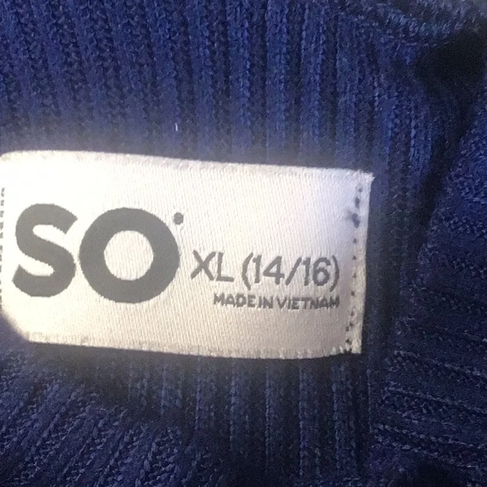 Fray features blue denim skirt with free knit top